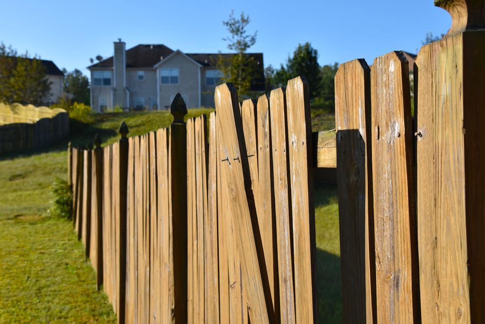 Professional fence repair contractor restoring damaged fencing in Greenville