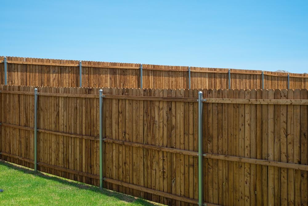 How to Choose a Fence That Stands Up to Greenville’s Climate (and Soil)