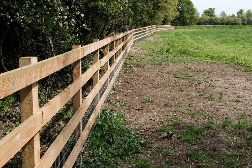 Greenville fencing contractor installing a custom residential fence in Greenville, SC